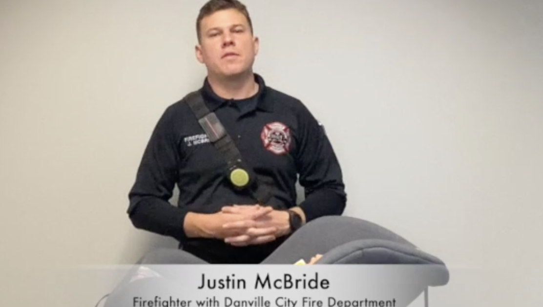 Justin McBride, a firefighter with Danville City Fire Department, addresses the camera for car seat safety.